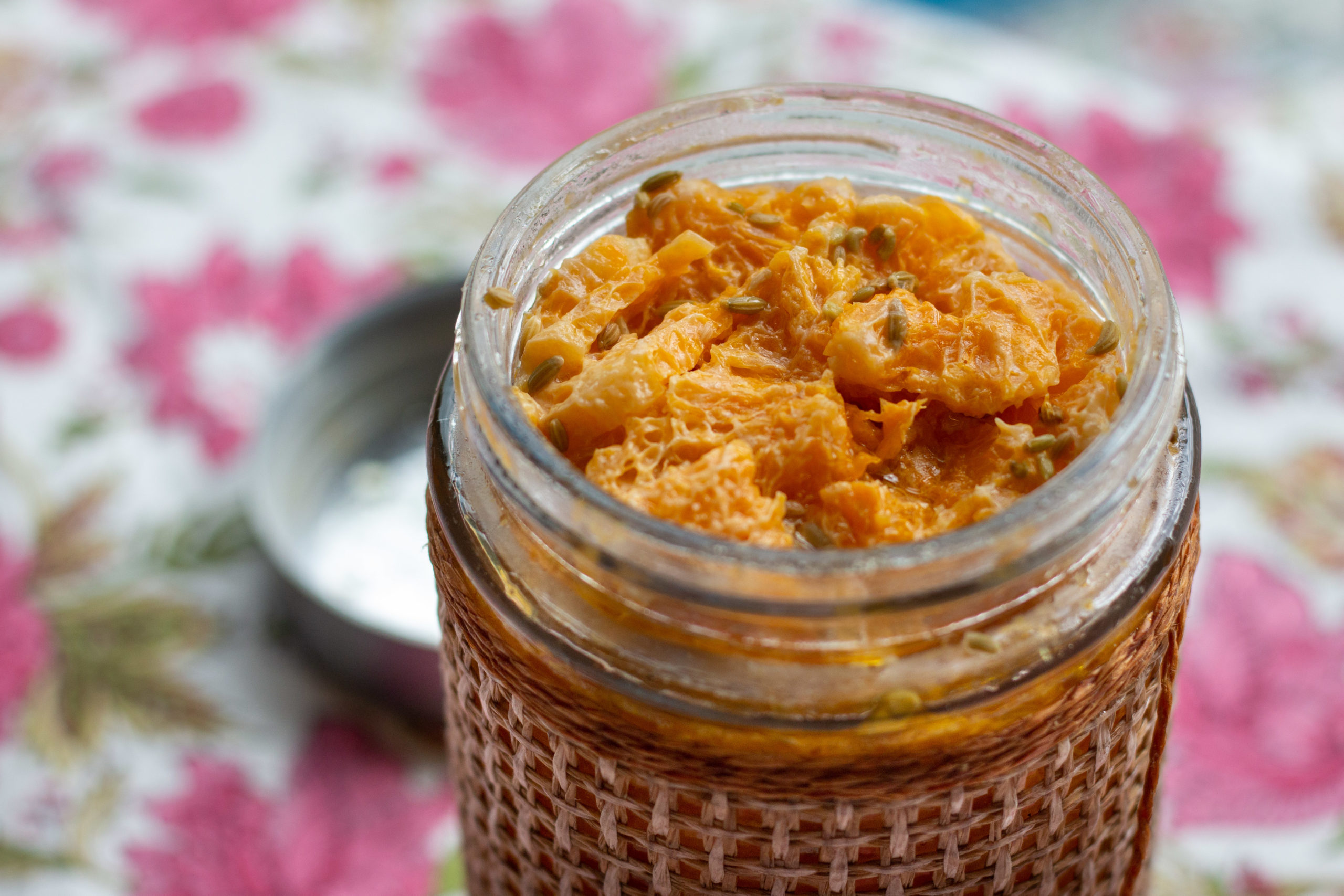 Fermented clementines in a glass jar