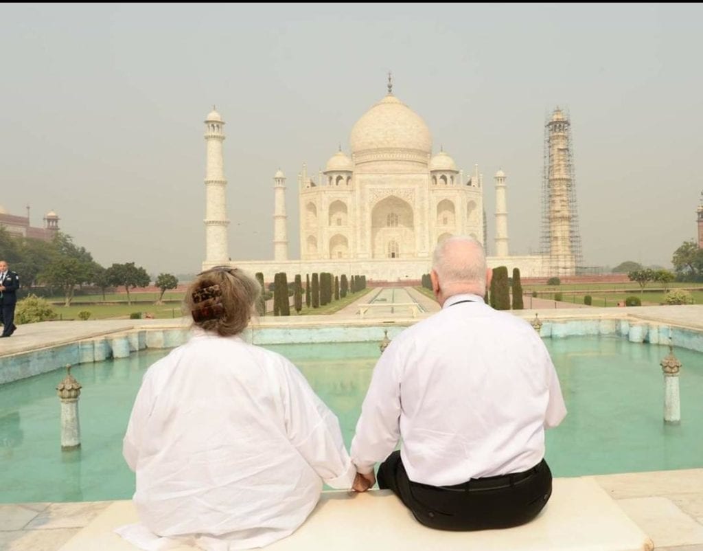 Nechama and Ruevain Rivlin in front of the Taj Mahal with their backs to the camera.