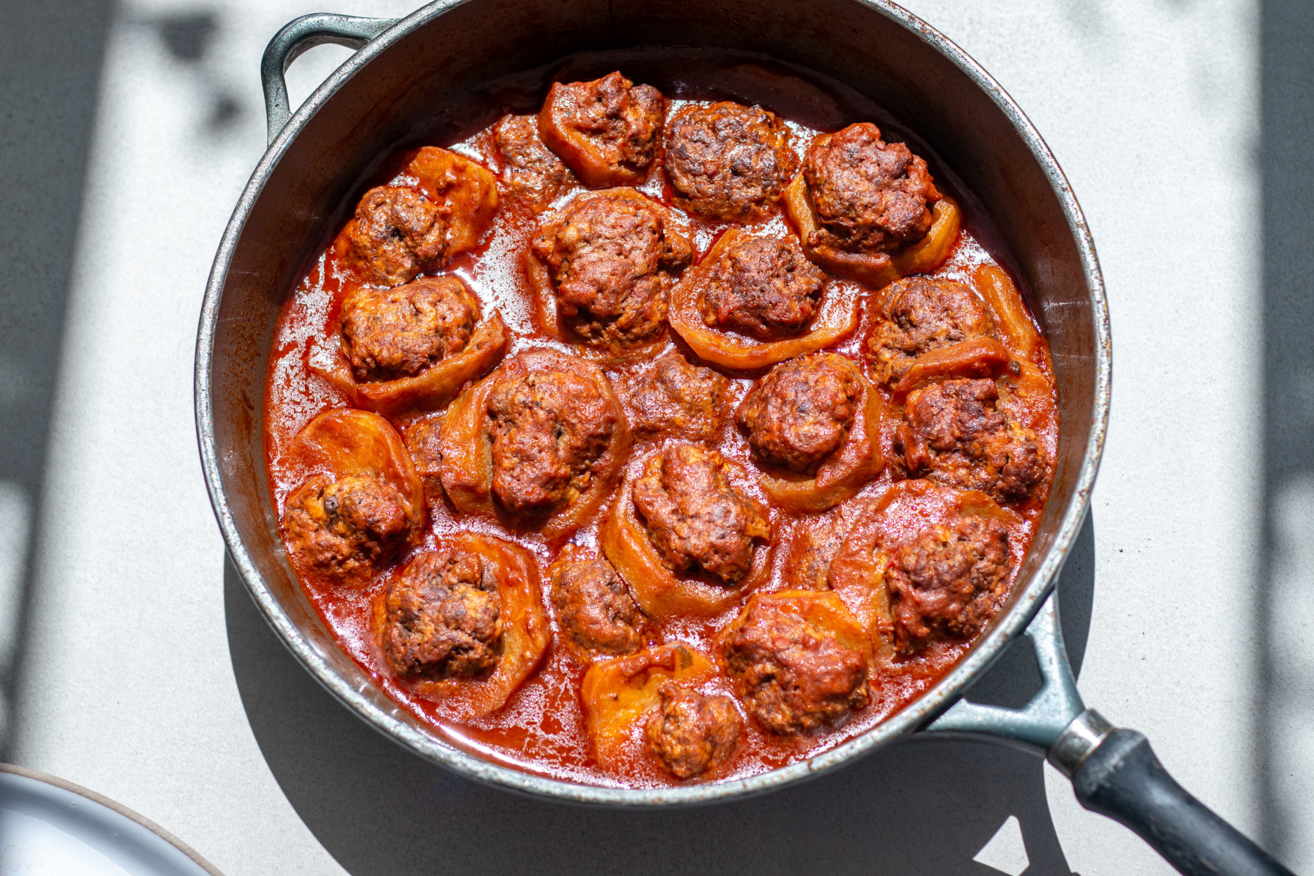 A pot of beef-stuffed eggplant called medias in tomato sauce