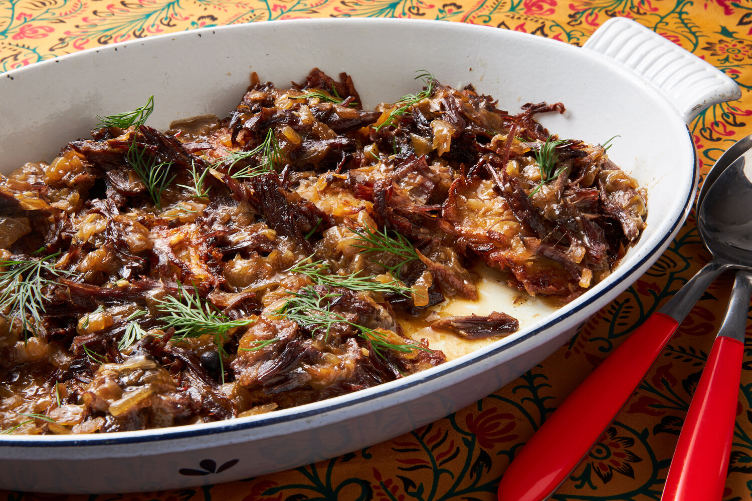 Latkes with short ribs in a casserole dish