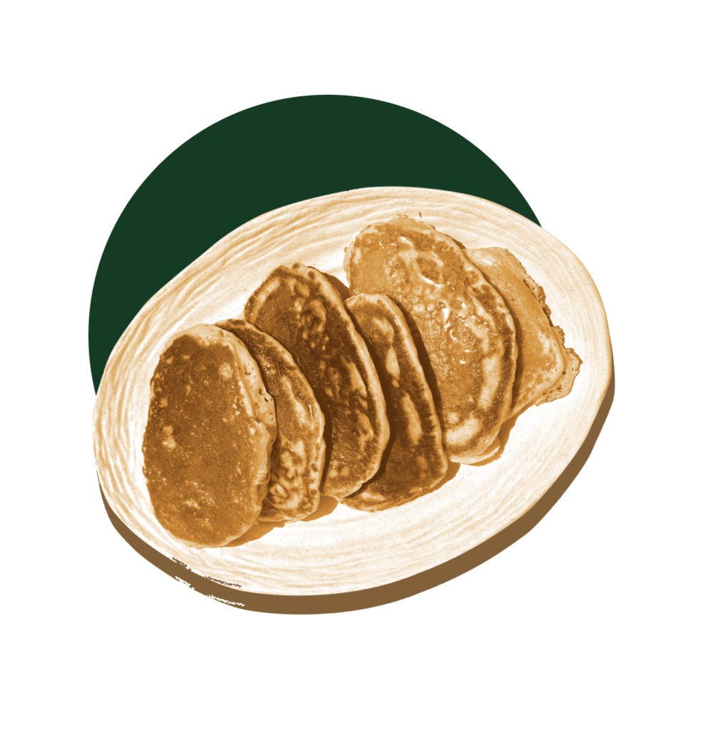 Pancakes on cream-colored oval platter