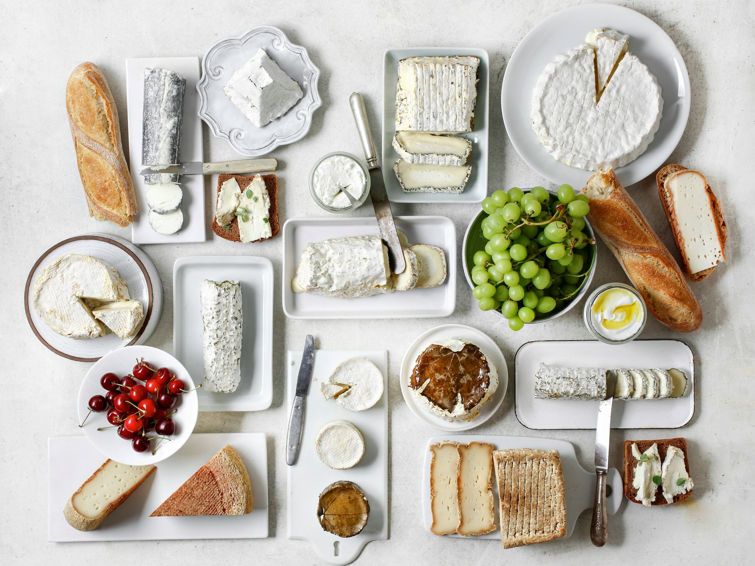 Spread of cheese, fruit, and bread