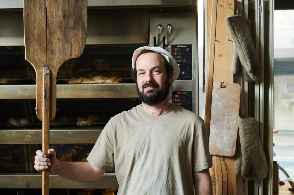 The baker Hagay Ben-Yehuda with his wooden peel