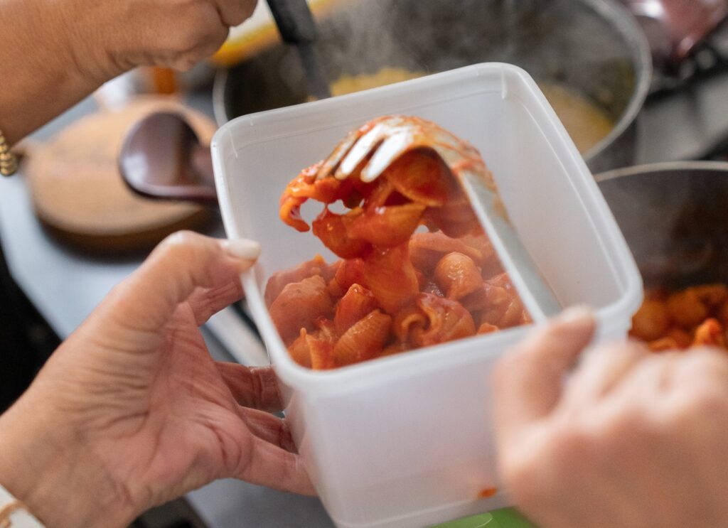Sigal Hayek filling pasta boxes